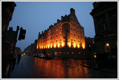 SAS Radisson Hotel, lit up in the pre-dawn, with light snow falling.  High Street.  Old Town.