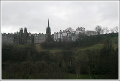 Princes Street Gardens on an overcast day.  In the background are buildings designed by Sir Patrick Geddes in 1893 and other Old Town buildings.