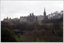 Princes Street Gardens on an overcast day.  In the background are buildings designed by Sir Patrick Geddes in 1893 and other Old Town buildings.