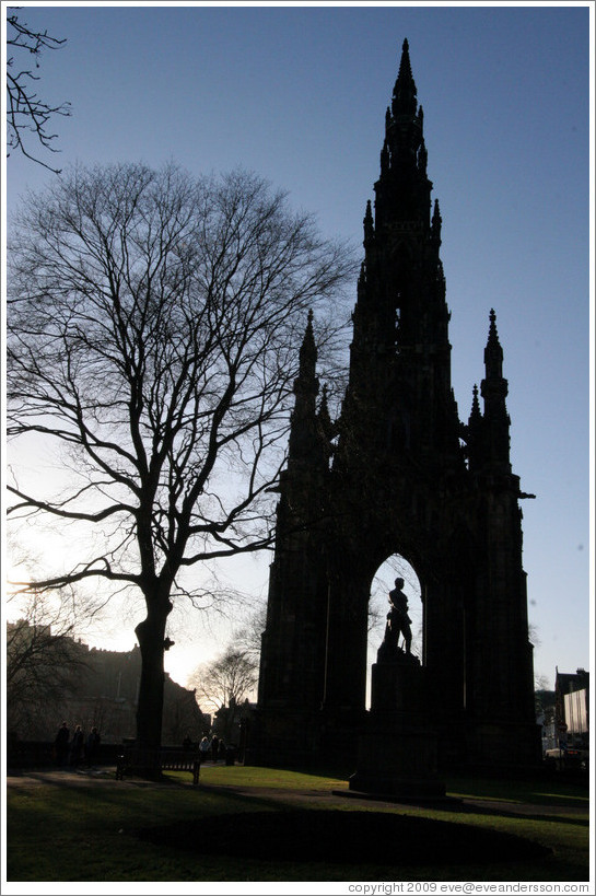 Silhouette of Scott Monument and tree.