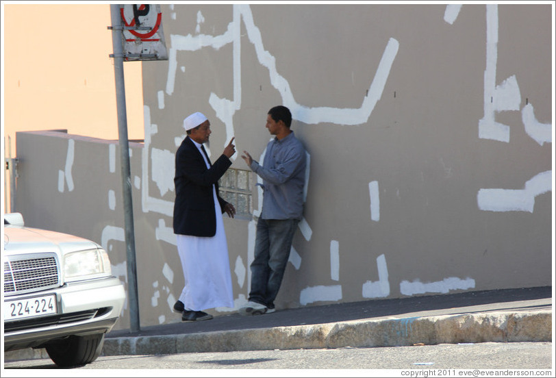 Two men talking. Hout street, Bo-Kaap.