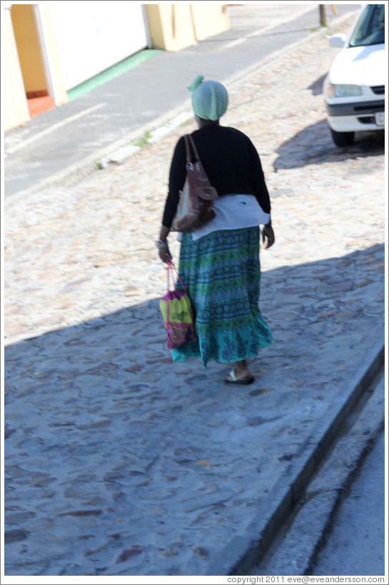Woman walking on Morris Street, Bo-Kaap.