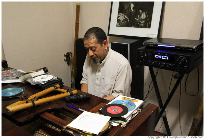 Cape Town jazz musician Hilton Schilder playing piano in his home.