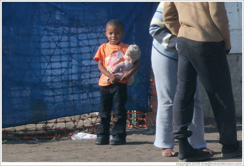 Child with doll.  Langa township.