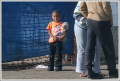 Child with doll.  Langa township.