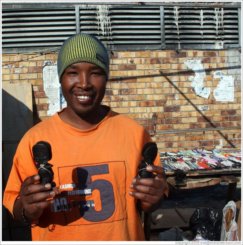 Kip, an excellent artist, with his wares.  Langa township.