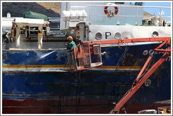 Man cleaning a boat.