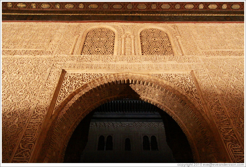 Arch leading to Patio del Cuarto Dorado, Nasrid Palace, Alhambra at night.