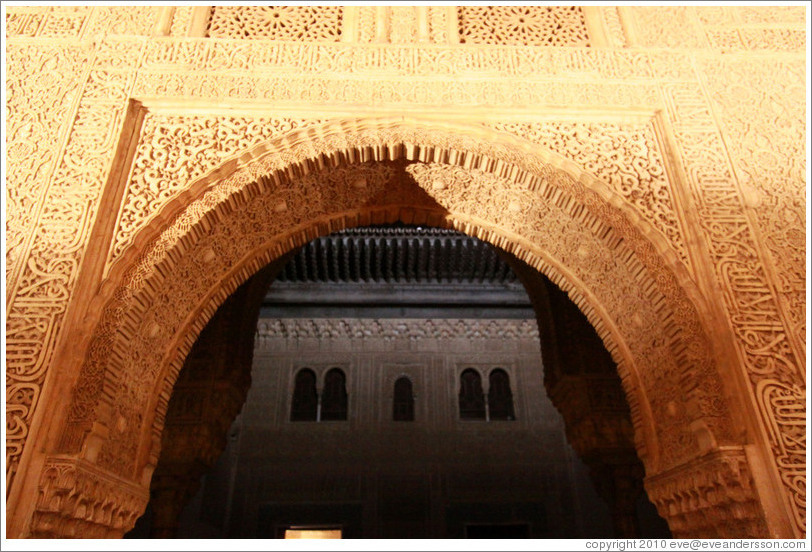 Arch leading to Patio del Cuarto Dorado, Nasrid Palace, Alhambra at night.