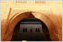 Arch leading to Patio del Cuarto Dorado, Nasrid Palace, Alhambra at night.