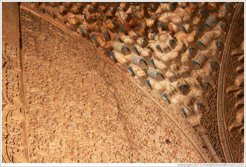 Wall with stucco pattern and portion of the ceiling with muqarnas, Sala de la Barca, Nasrid Palace, Alhambra at night.