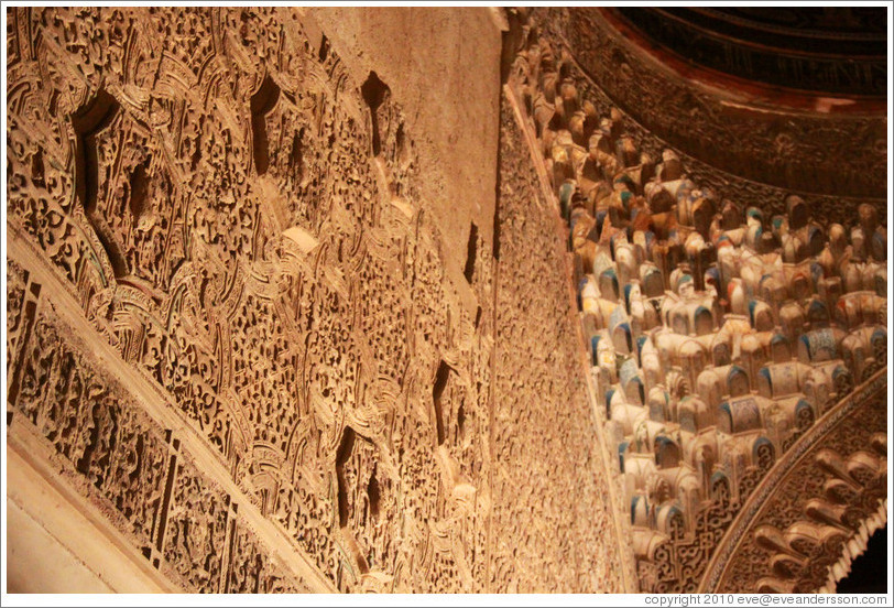Wall with stucco pattern and portion of the ceiling with muqarnas, Sala de la Barca, Nasrid Palace, Alhambra at night.