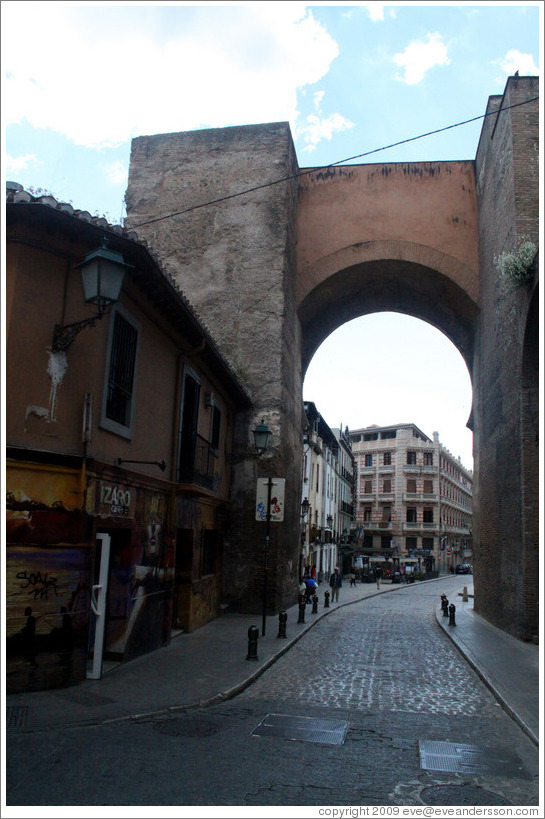 Arch over Calle Triunfo, near Calle de Elvira.  City center.