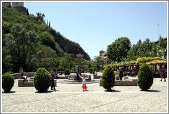 Girl in front of fountain.  Paseo de los Tristes (Promenade of the Sad).  City center.