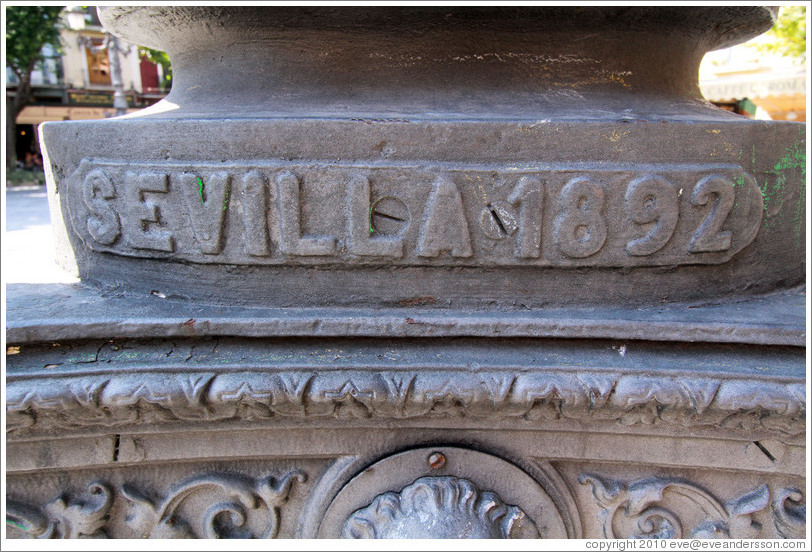 Lamppost detail reading "Sevilla 1892". Plaza de Bib-Rambla, city center.