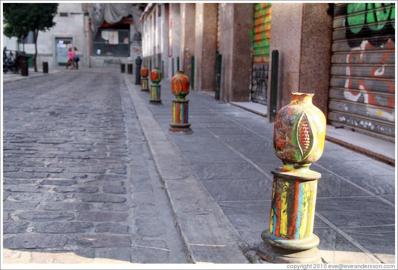 Colorful pomegranate bollards, Plaza de San Agust? city center.