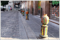 Colorful pomegranate bollards, Plaza de San Agust? city center.