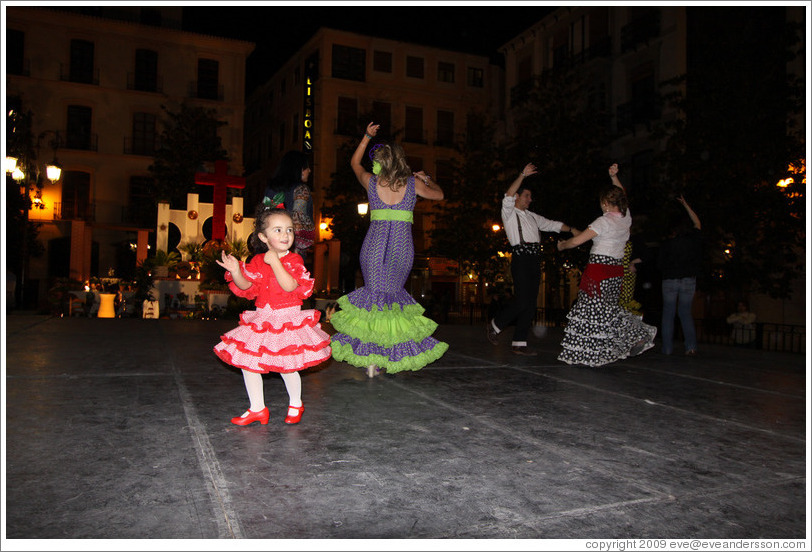 People dancing flamenco on the street at night during the Fiesta de las Cruces.  Plaza del Carmen.  City center.