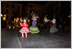 People dancing flamenco on the street at night during the Fiesta de las Cruces.  Plaza del Carmen.  City center.