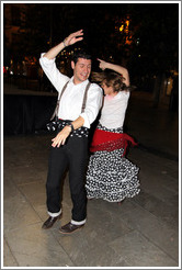 Man and woman dancing flamenco on the street at night during the Fiesta de las Cruces.  Plaza del Carmen.  City center.