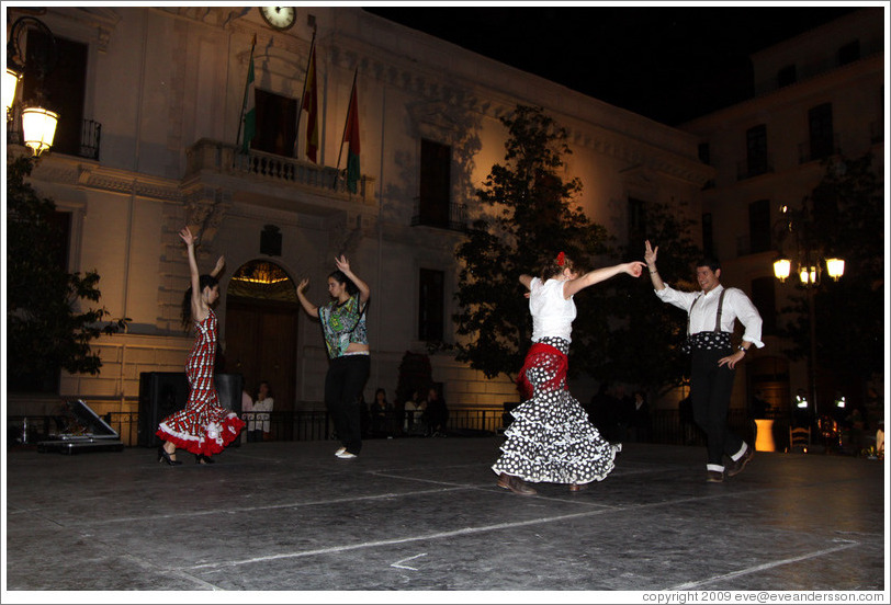 People dancing flamenco on the street at night during the Fiesta de las Cruces.  Plaza del Carmen.  City center.