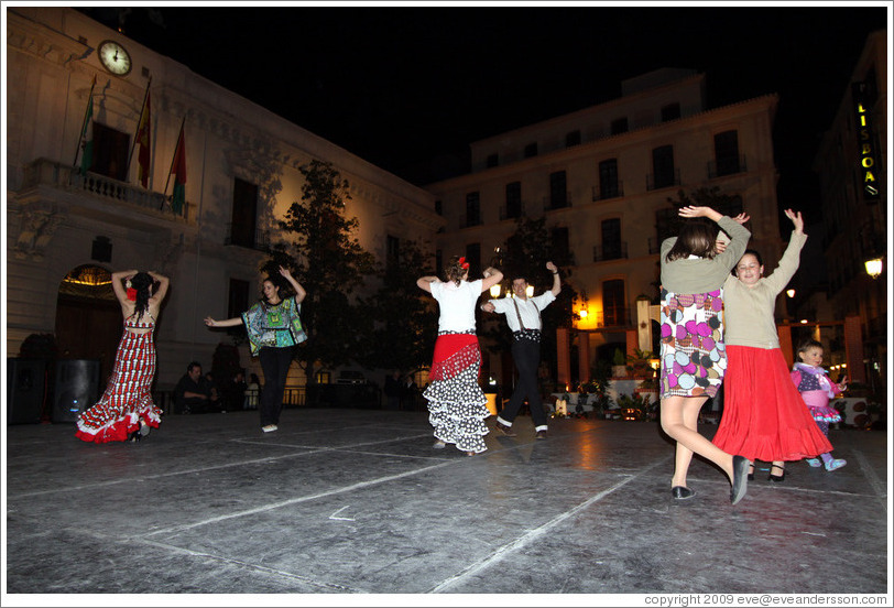 People dancing flamenco on the street at night during the Fiesta de las Cruces.  Plaza del Carmen.  City center.