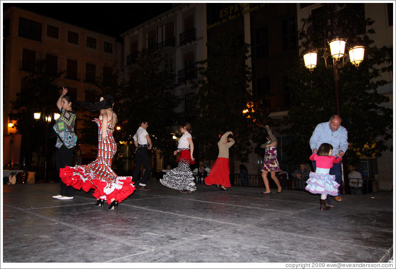 People dancing flamenco on the street at night during the Fiesta de las Cruces.  Plaza del Carmen.  City center.