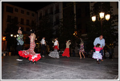 People dancing flamenco on the street at night during the Fiesta de las Cruces.  Plaza del Carmen.  City center.