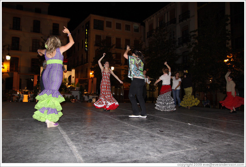 People dancing flamenco on the street at night during the Fiesta de las Cruces.  Plaza del Carmen.  City center.