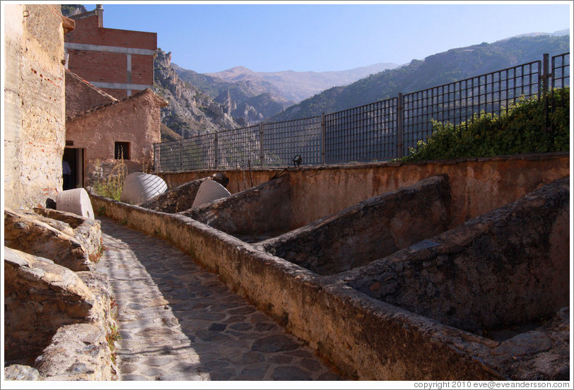 Outdoor bins, where olives were initially dropped off. 15th century Moorish olive oil mill, used by the town of Nig?elas until 1920.