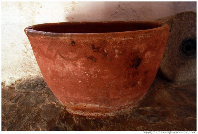 Terra cotta container from the 13th century. In a 15th century Moorish olive oil mill, used by the town of Nig?elas until 1920.