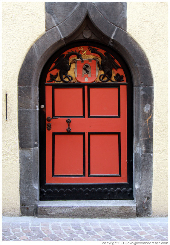 Door with dragons tying a ribbon, Rathaus, Old Town, Chur.