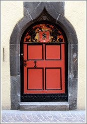 Door with dragons tying a ribbon, Rathaus, Old Town, Chur.