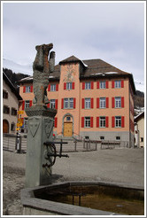 Bear sculpture atop fountain, the village of Zuoz.