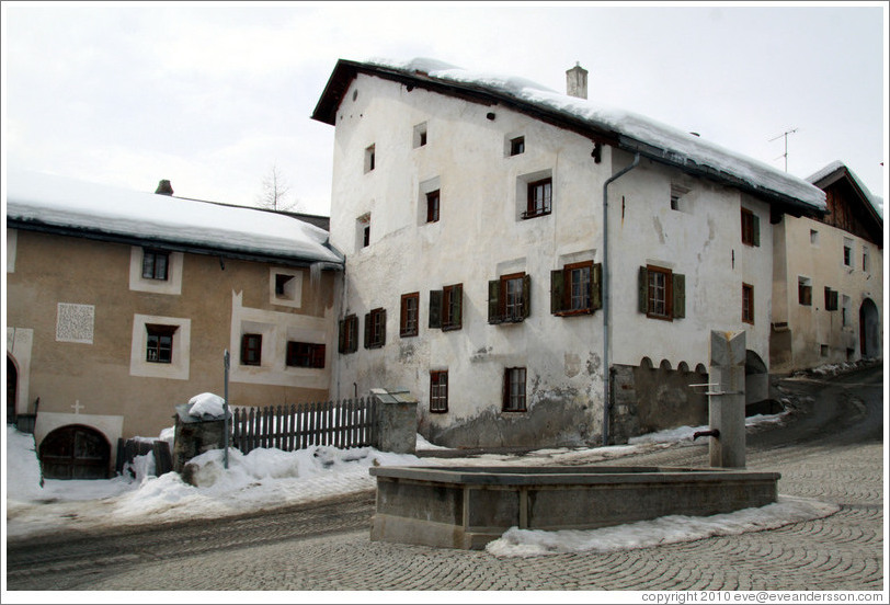 Fountain and Romansh buildings, Zuoz.