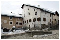 Fountain and Romansh buildings, Zuoz.