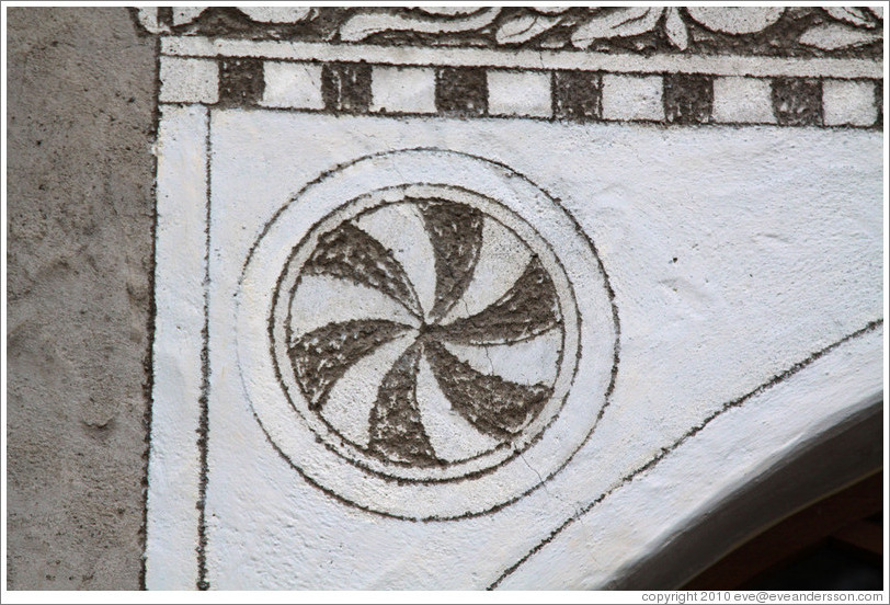 Pinwheel pattern, a typical Romansh adornment.  Zuoz.