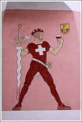 Swiss man with swords and a glass of wine, painted on the side of a building.