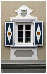 Window.  Shutters show a typical Romansh pattern.