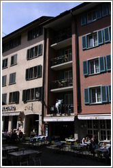 Swiss Chuci restaurant, with tables and cow on balconies.  Altstadt (Old Town).