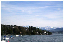 Layers of clouds and the shore of Z?richsee (Lake Z?rich) at K?snacht.