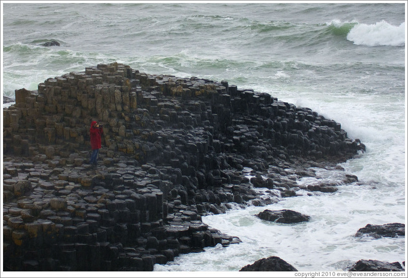 Eve, standing on Giant's Causeway (the only person remaining after a sudden downpour).