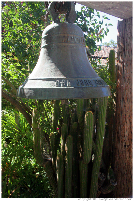 Bell in garden.  San Juan Bautista Mission.