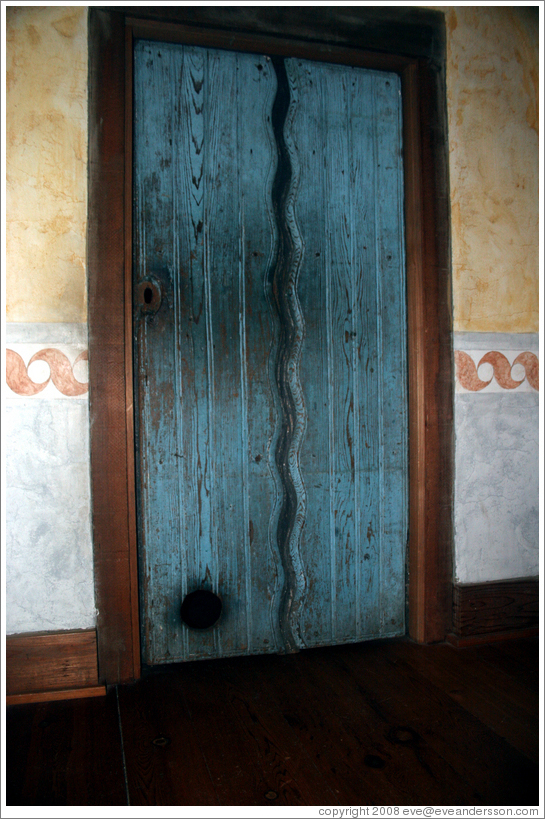 Door containing cat door.  Guadalupe Chapel.  San Juan Bautista Mission.