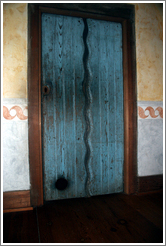 Door containing cat door.  Guadalupe Chapel.  San Juan Bautista Mission.