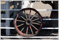 Wagon wheel on fence.  Tres Hermanas Winery.