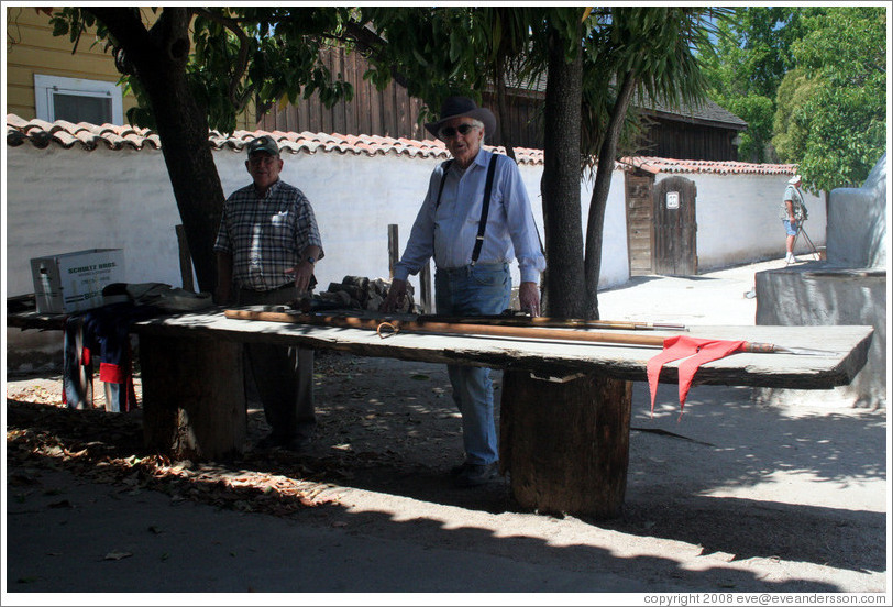 Guides demonstrating weapons and uniforms used by 19th century Mexican army troops.  Sonoma Barracks.