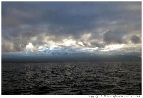 Dark sky over either Molokai or Lanai as seen from Maui. 