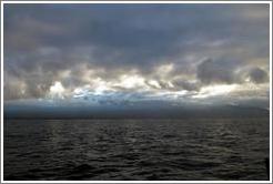 Dark sky over either Molokai or Lanai as seen from Maui. 