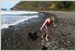 Eve plays with dog.  North coast of Maui.